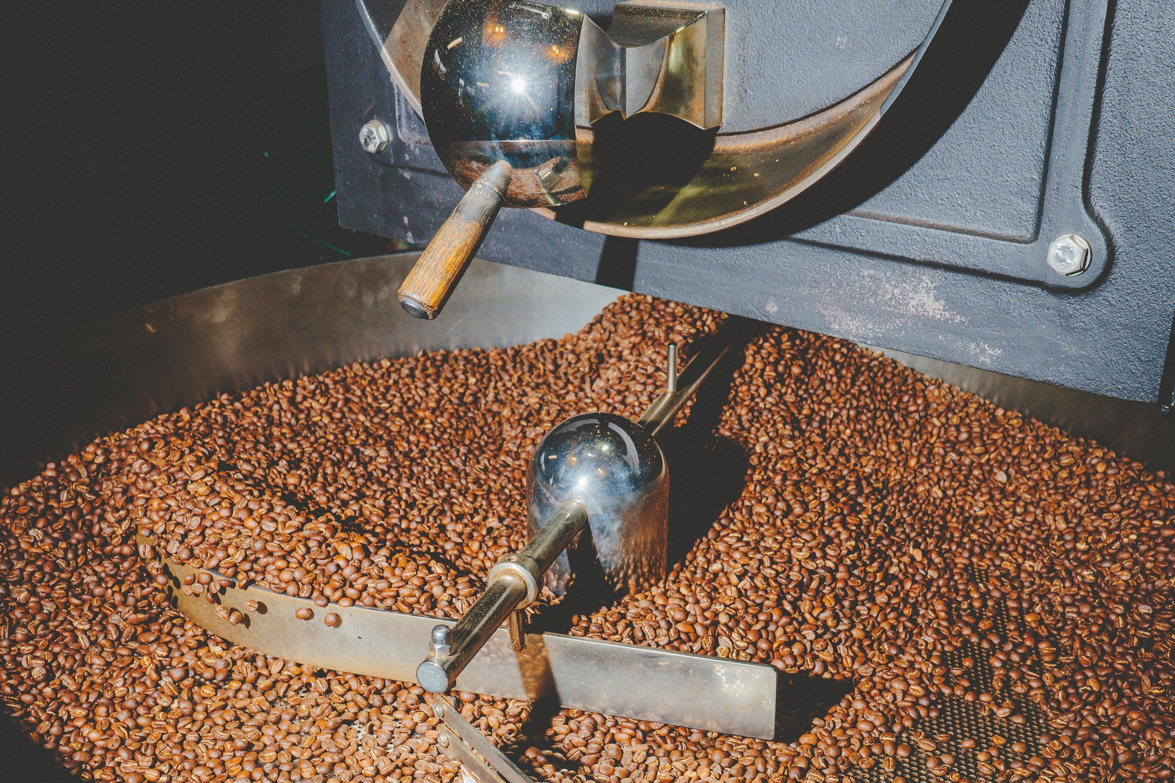 Coffee roasting machine with coffee beans inside, brand 'Giesen' visible